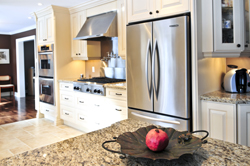 Interior of modern luxury kitchen with stainless steel appliances